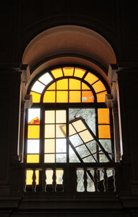 Low angle view of glass window in historic building