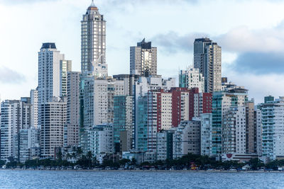 Modern buildings in city against sky