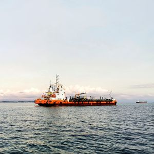 Ship in sea against sky