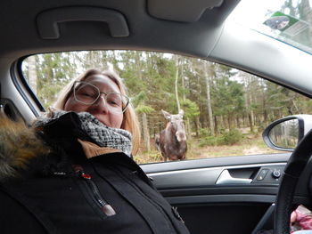 Portrait of woman in car