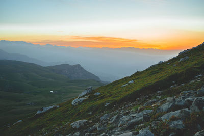 Scenic view of mountains against sky during sunset