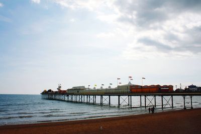 Pier over sea against sky