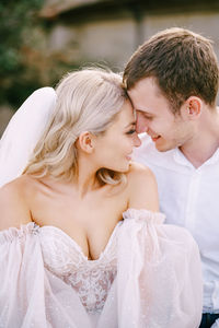 Couple embracing during wedding ceremony outdoor