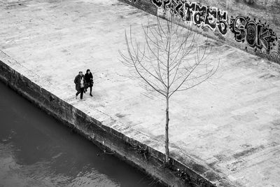 People on road amidst water