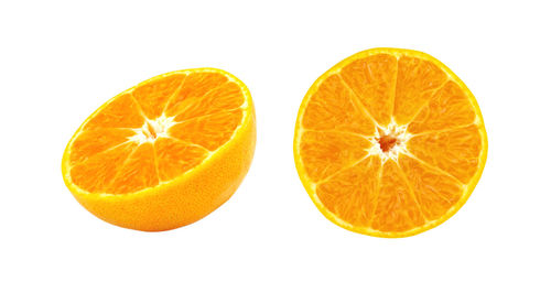 Close-up of orange slice against white background