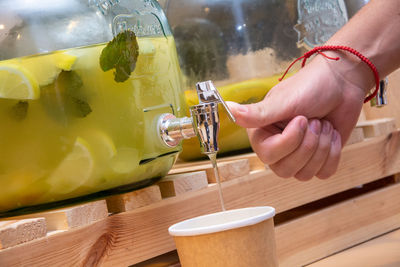 Close-up of hand holding drink