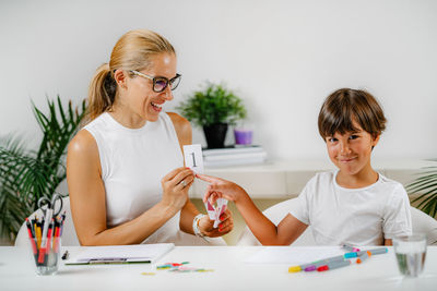 Child recognizing numbers in a preschool assessment test.