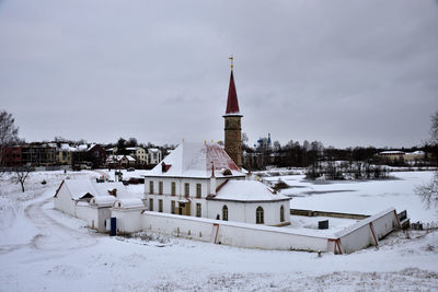 Buildings against sky during winter