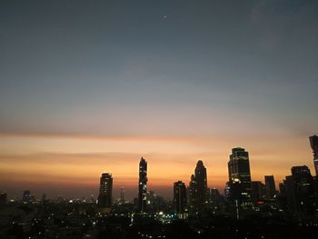 Cityscape against sky during sunset