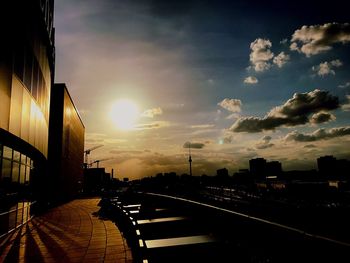 View of railroad tracks against cloudy sky