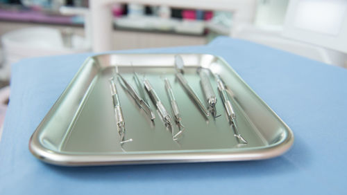 High angle view of dental equipment in tray on table