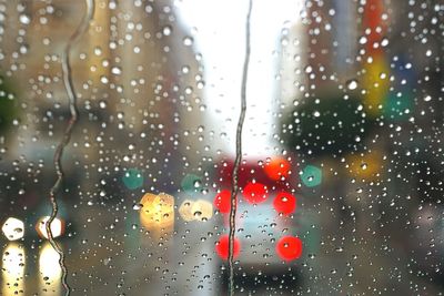 Close-up of wet car windshield during rainy season