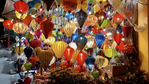 Colorful lanterns hanging at market stall