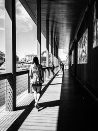 Full length of woman walking on road