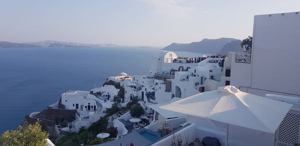 High angle view of buildings by sea