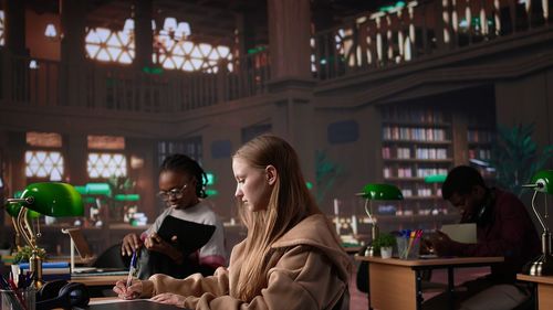 Rear view of woman standing in city at night