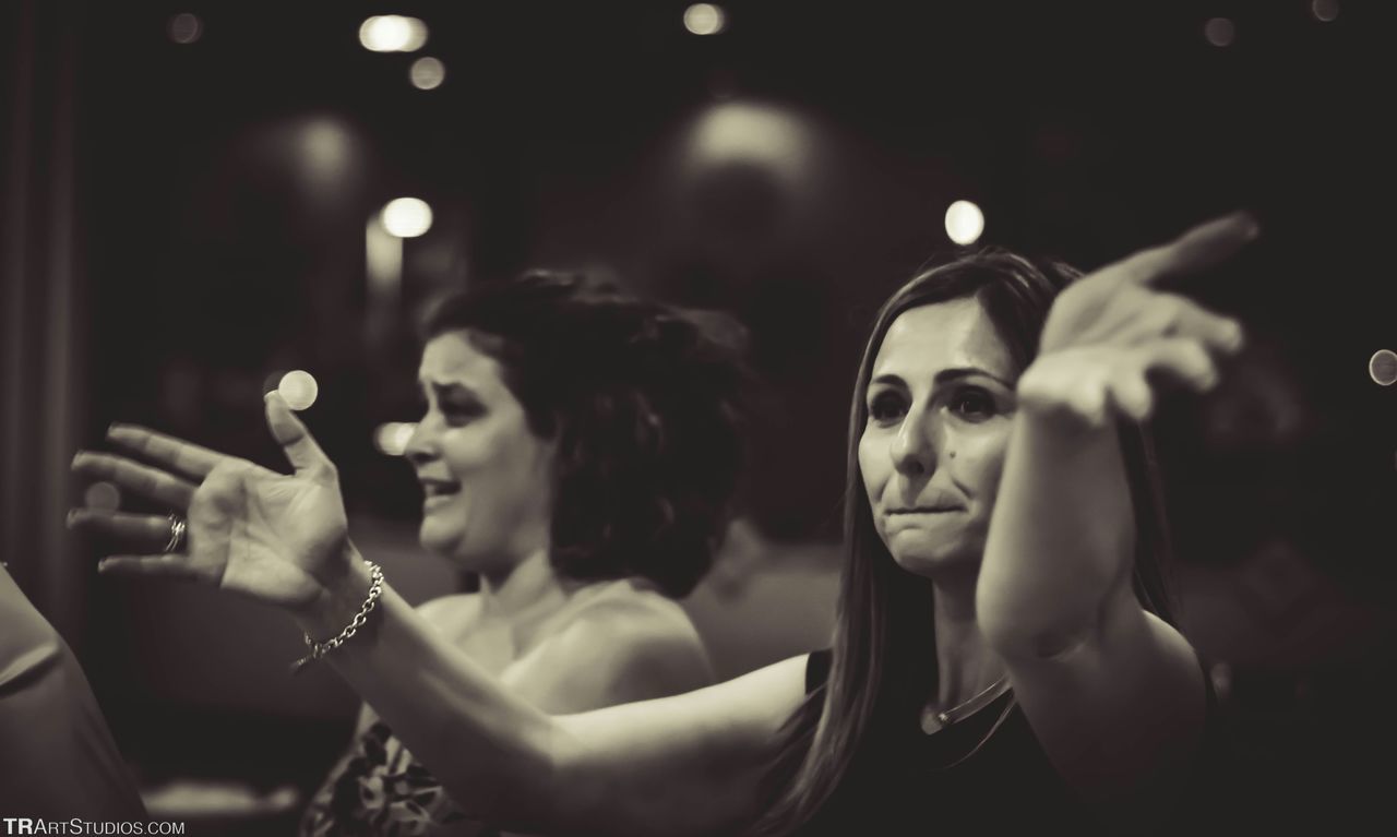 WOMAN LOOKING AT MUSIC CONCERT