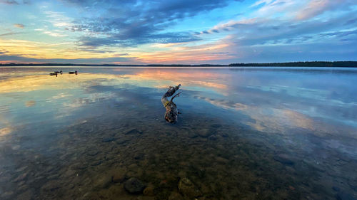 Scenic view of sea against sky during sunset