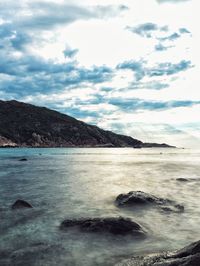 Scenic view of sea against cloudy sky