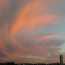 Low angle view of cloudy sky at sunset