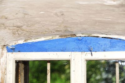 Close-up of blue window on wall