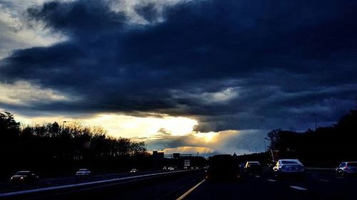 Road passing through dramatic sky