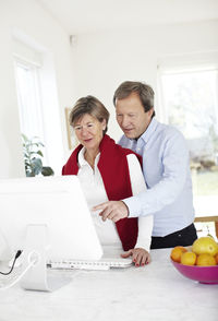 Mature couple using computer