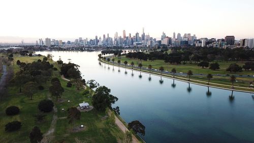 Panoramic view of river and buildings in city against sky