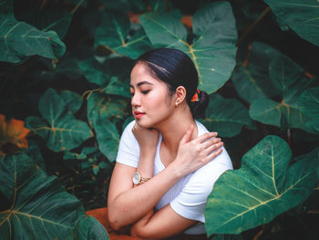 Young woman looking away outdoors