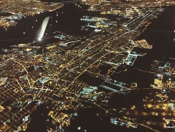 Aerial view of illuminated cityscape at night