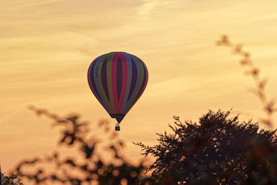 Hot air balloon against sky during sunset