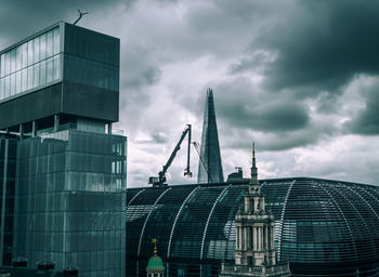 Modern building against cloudy sky