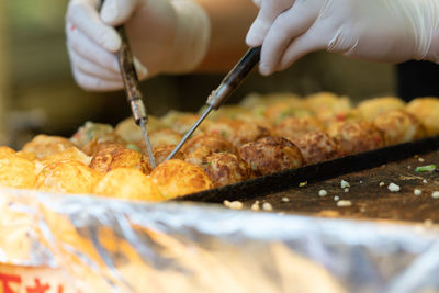 Close-up of person preparing food