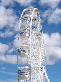 Low angle view of ferris wheel against sky