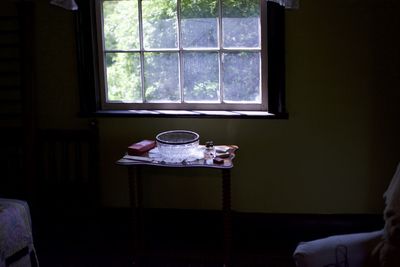 Man on table by window at home