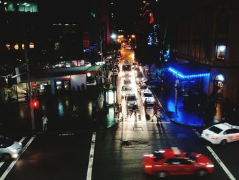 Traffic on city street during rainy season at night