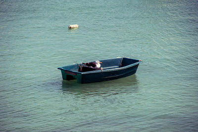 High angle view of people on boat sailing in sea
