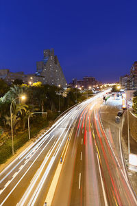 High angle view of light trails on road at night