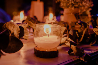 Close-up of tea light candles on table