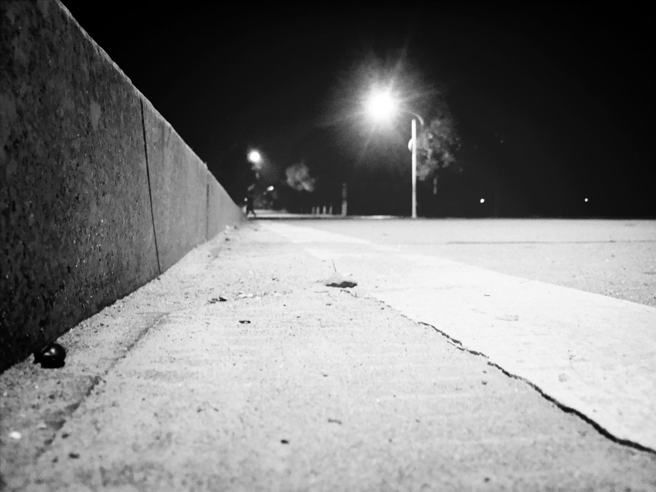 night, illuminated, street light, the way forward, lighting equipment, street, road, built structure, diminishing perspective, architecture, building exterior, transportation, empty, light - natural phenomenon, vanishing point, outdoors, dark, snow, electric light, winter