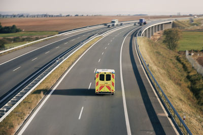 Fast moving ambulance car of emergency medical service on highway. 