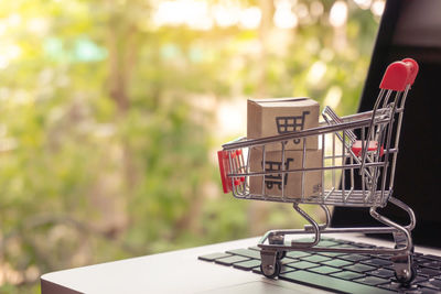 Close-up of red wine in basket on table