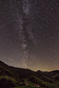 Scenic view of star field against sky at night