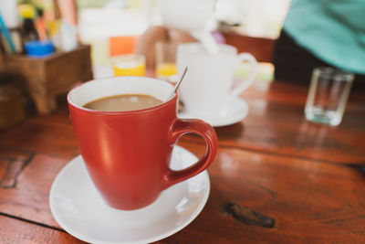 Close-up of coffee cup on table