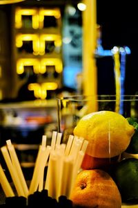 Close-up of yellow fruits on glass