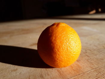 Close-up of orange slice on cutting board