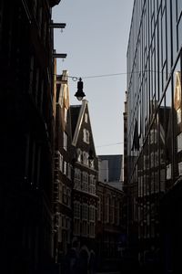 Low angle view of buildings in city against sky