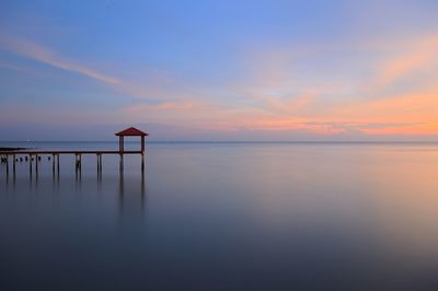 Scenic view of sea against sky at sunset