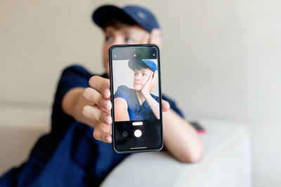 Midsection of woman using mobile phone