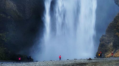 People against waterfall